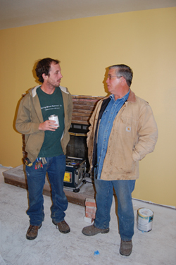 Construction manager Eddie Sherman talks to homeowner Jack Wright